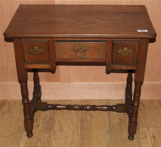 An 17th century style oak lowboy, W.78cms